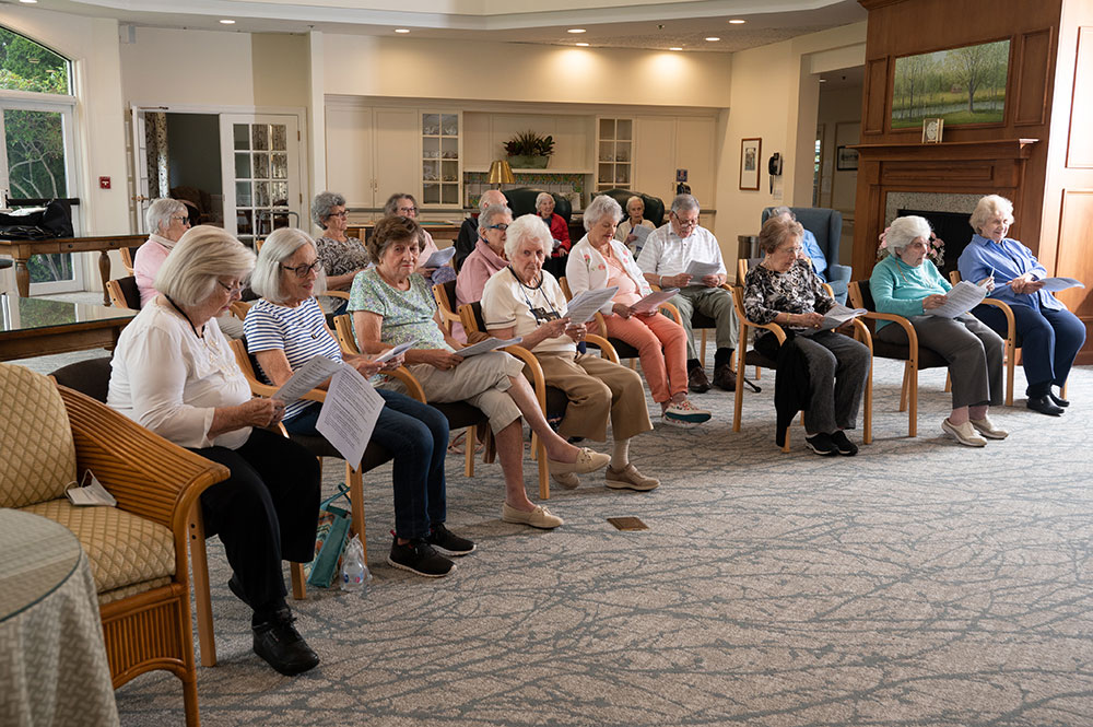 group of residents sitting in rows of chairs