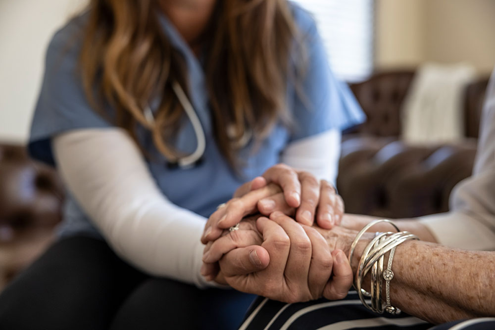 A senior woman at home receiving healthcare.